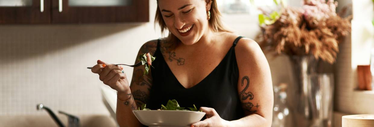 Woman eating salad
