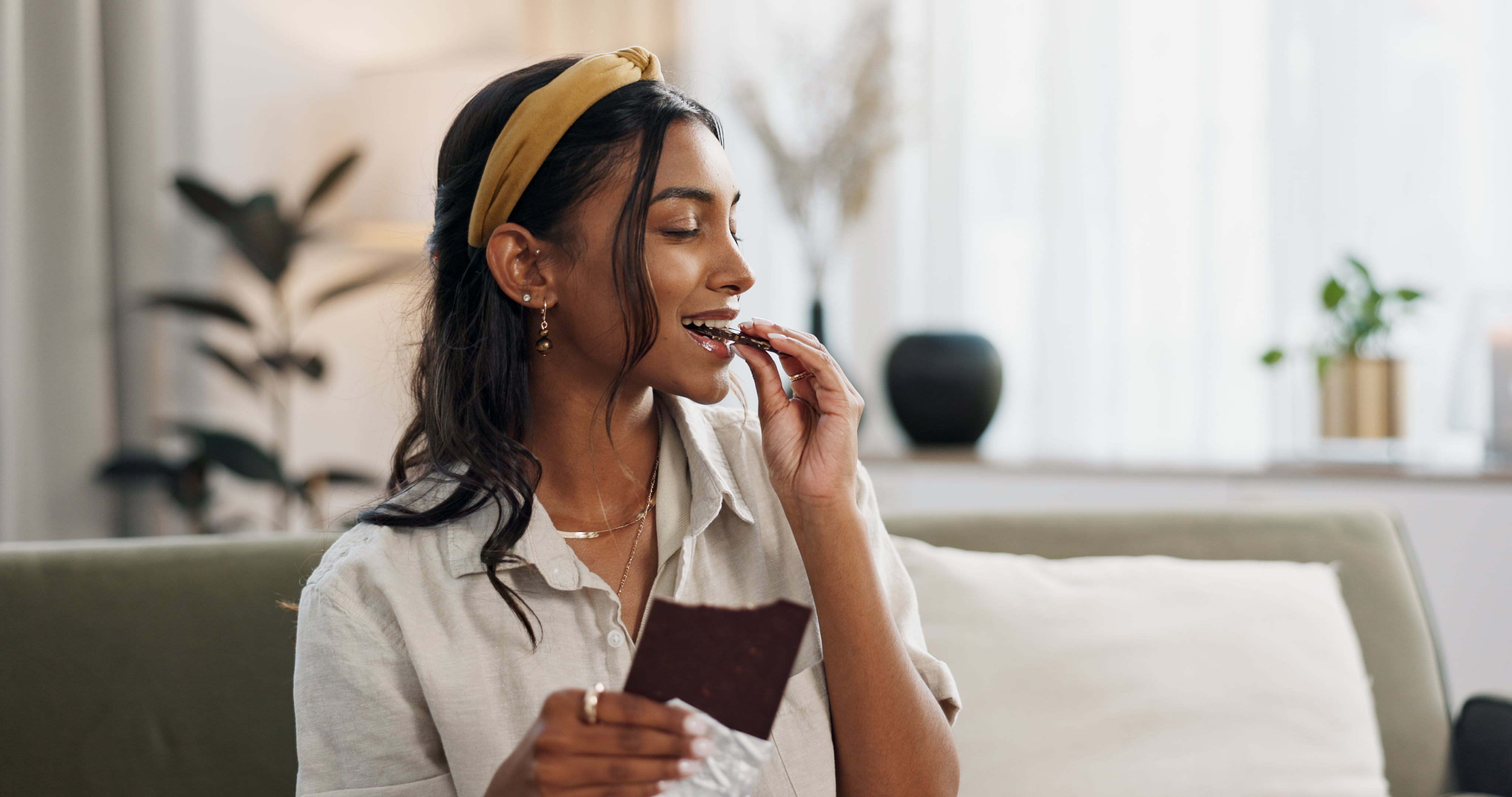 Woman eating chocolate bar