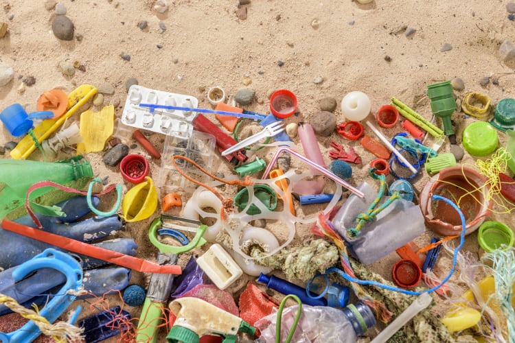 Behind the tech evian says 'decouples PET from fossil fuels' and 'keeps plastic out of nature'