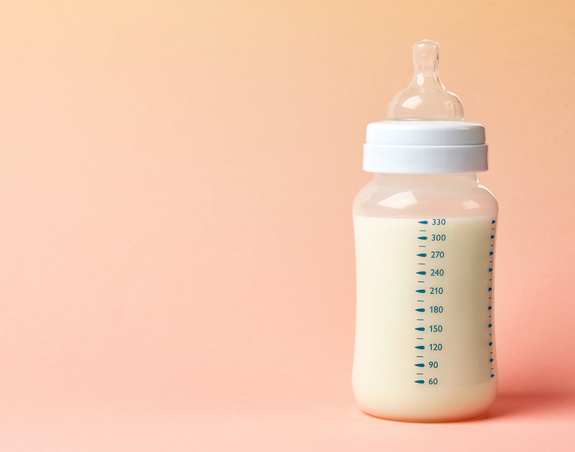 baby milk bottle on pink background