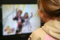 young girl watching TV