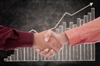 acquisition merger business profit joint venture partner iStock.com CreativaImages
