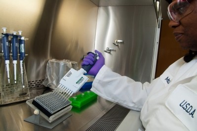 An FSIS microbiologist adds reagents for a non-O157:H7 E. coli analysis at the agency’s laboratory in Athens, Georgia. 