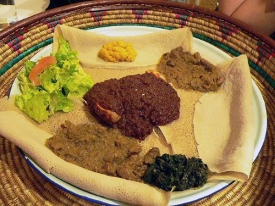 A typical Ethiopian meal with Injera - a sourdough-risen flatbread with a slightly spongy texture traditionally made from teff flour. 