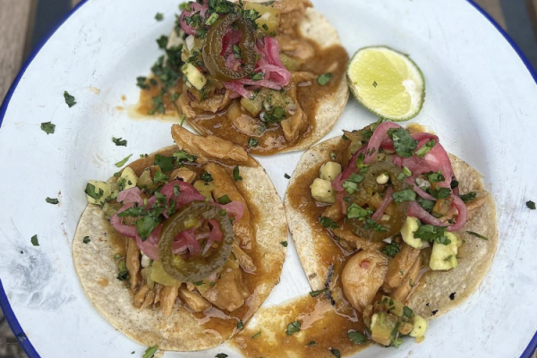 Eatplanted chicken tacos with pink pickled onions, blackened pineapple, avocado pico and corn tortillas