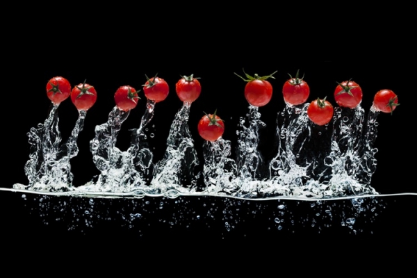 Tomatoes jumping out of water Getty