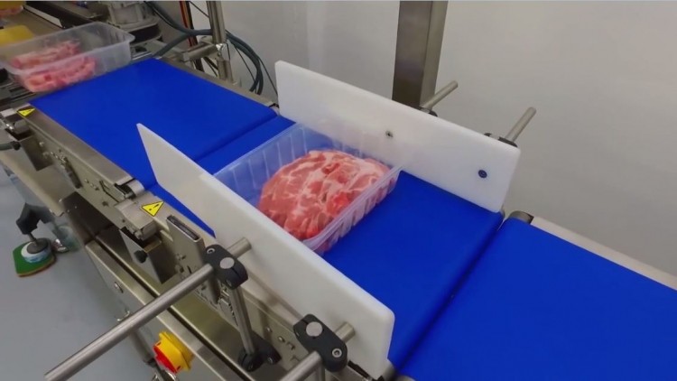 SATO developed a machine that can weigh and label 50 meat trays per minute
