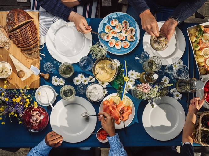 Swedish summer Midsommar Midsummer celebration dinner party. Image Getty/knape