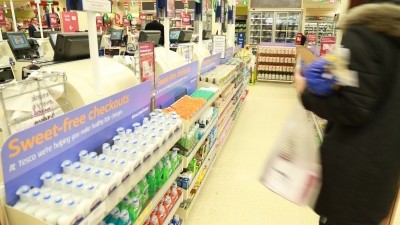 Tesco has implemented rules on products listed in place of candy and chocolate at the checkouts, including no 'red' traffic light ratings